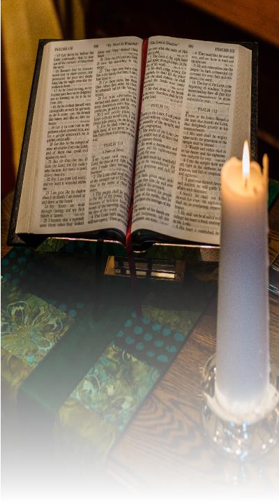 Open Bible and Candle